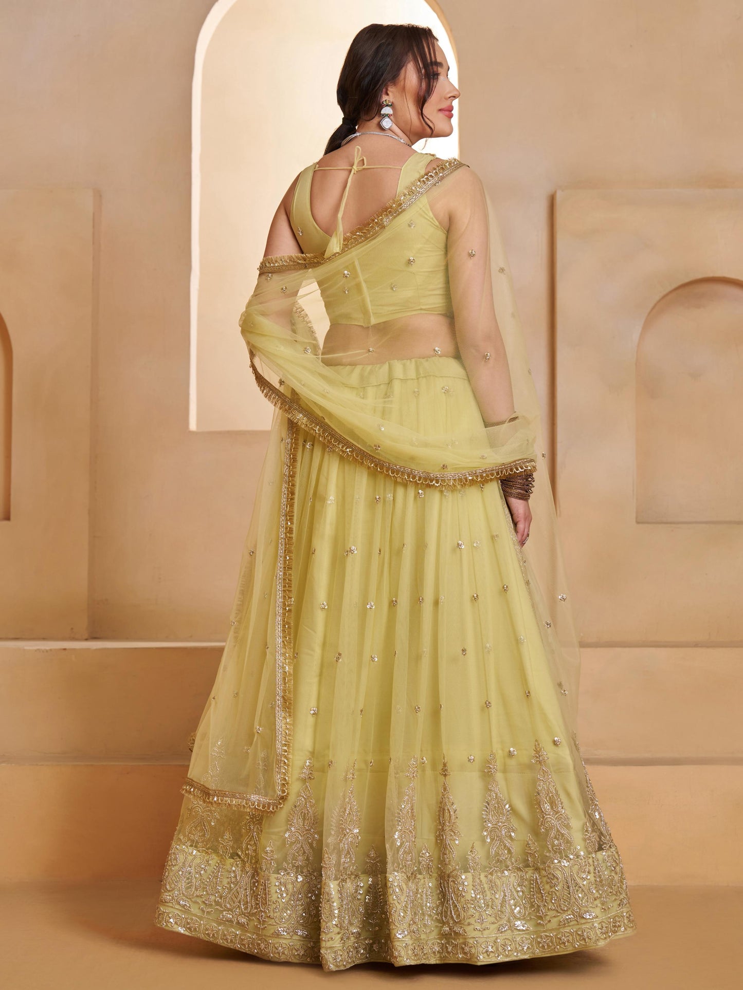 Alluring Green Embroidered Net Mehndi Wear Lehenga Choli