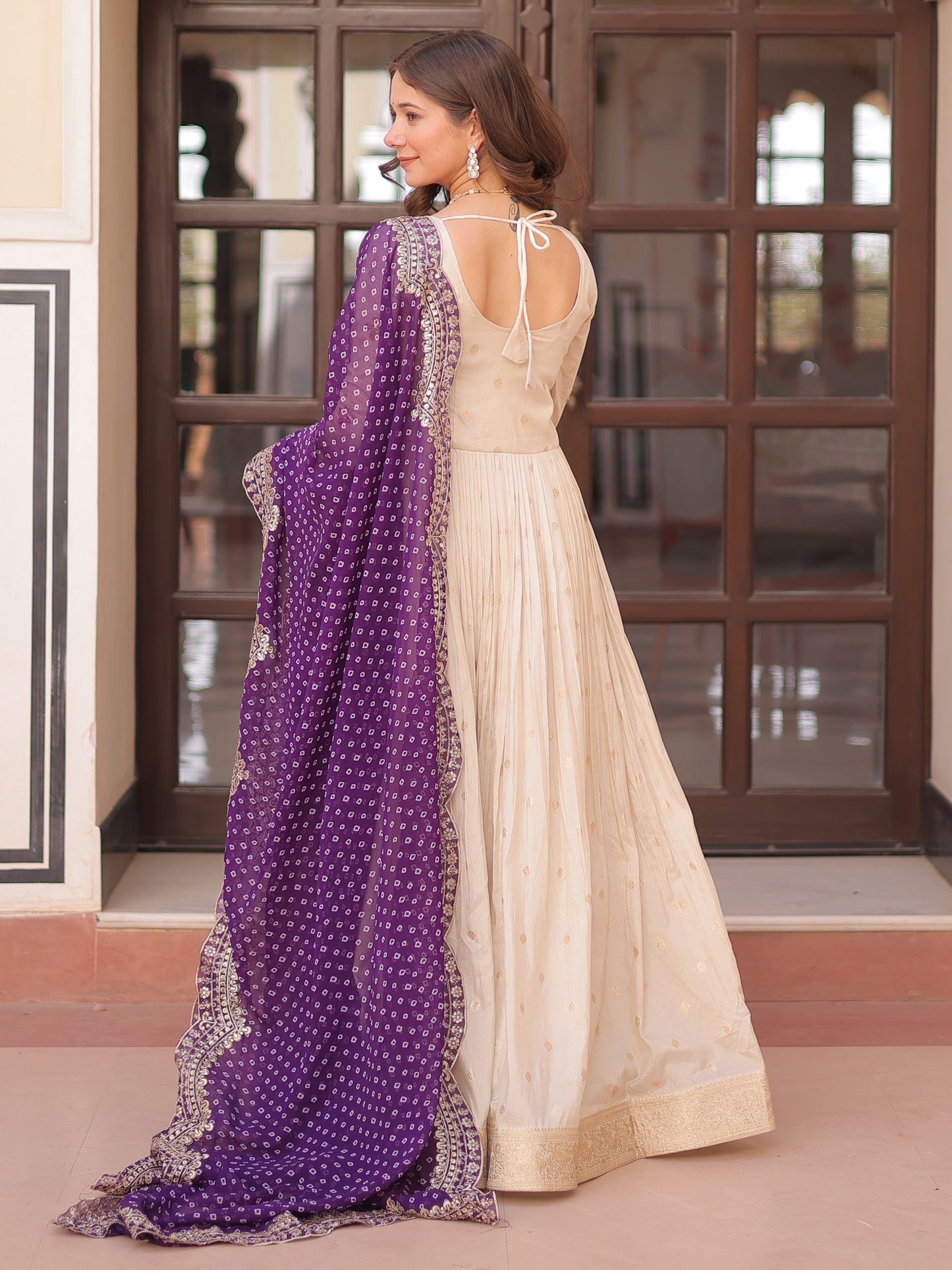 Attractive Cream Zari Work Silk Gown With Bandhani Dupatta