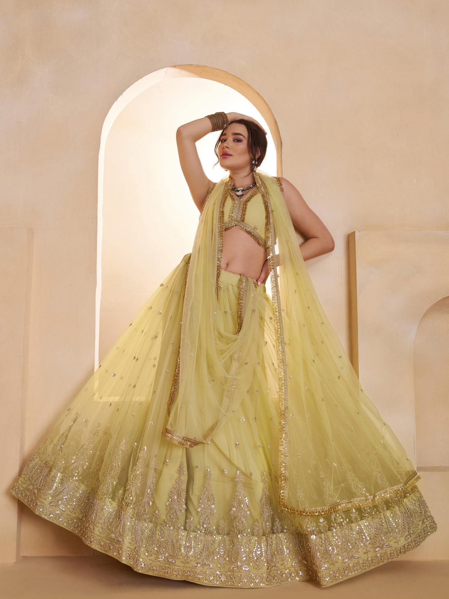 Alluring Green Embroidered Net Mehndi Wear Lehenga Choli