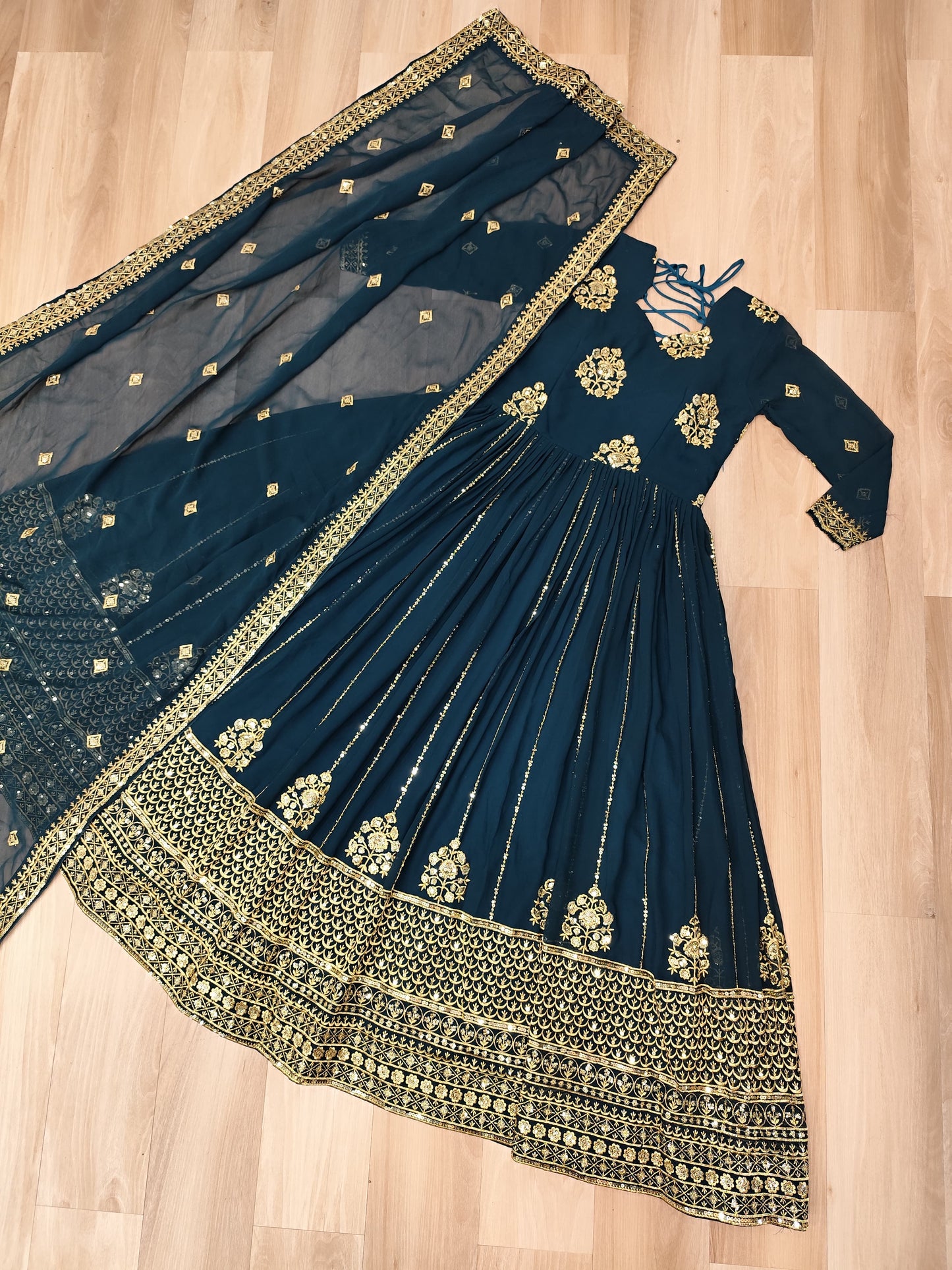 Winsome Dark Green Zari Work Georgette Engagement Wear Gown