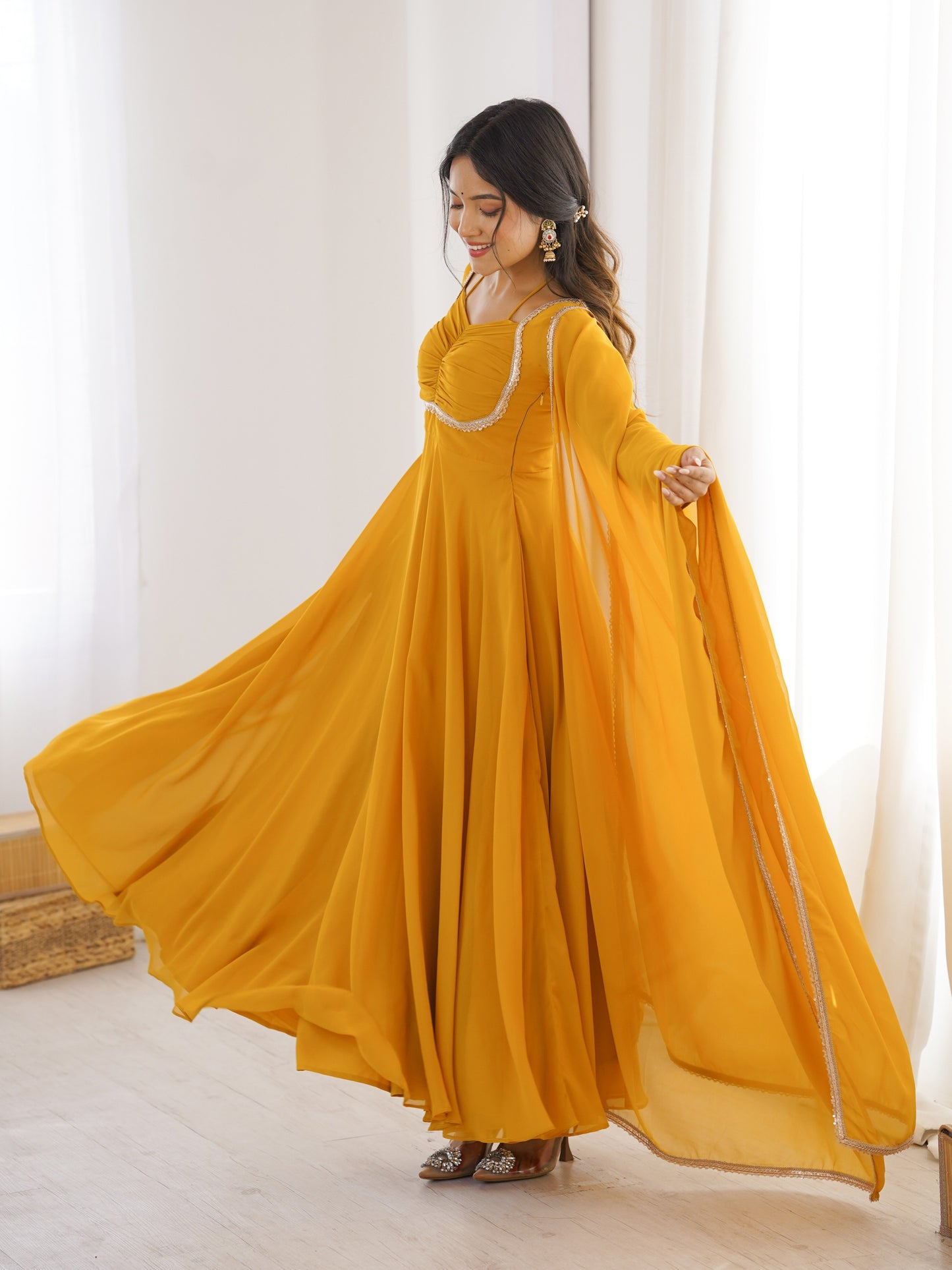 Astonishing Yellow Plain Georgette Haldi Wear Gown
