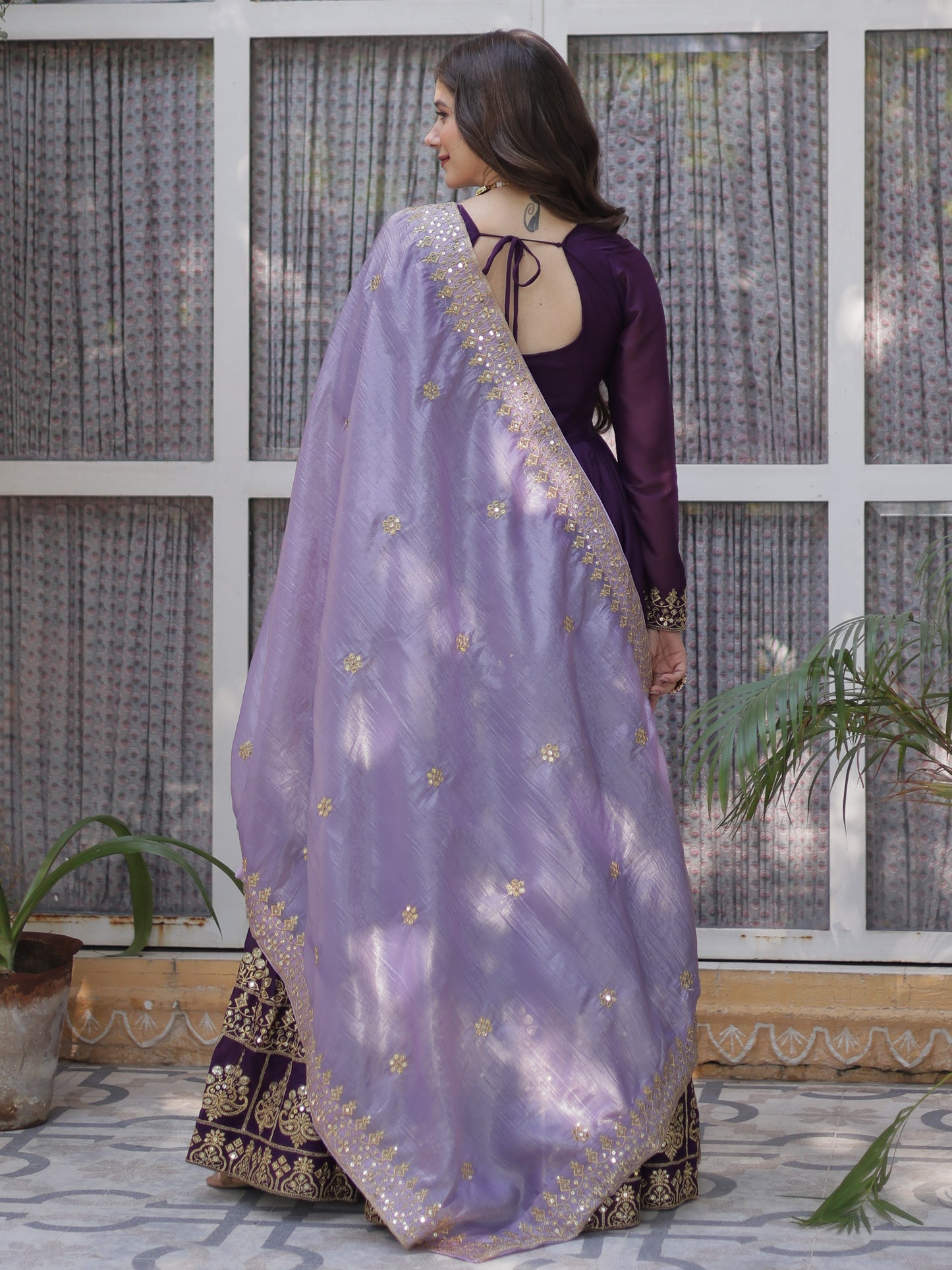 Charming Purple Zari Work Georgette Reception Wear Gown