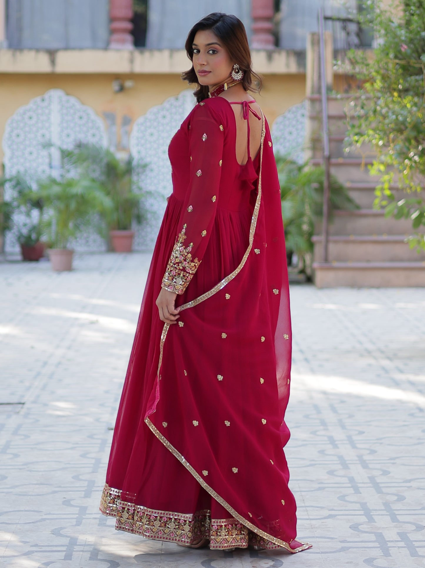 Ravishing Dark Pink Zari Work Georgette Engagement Wear Gown