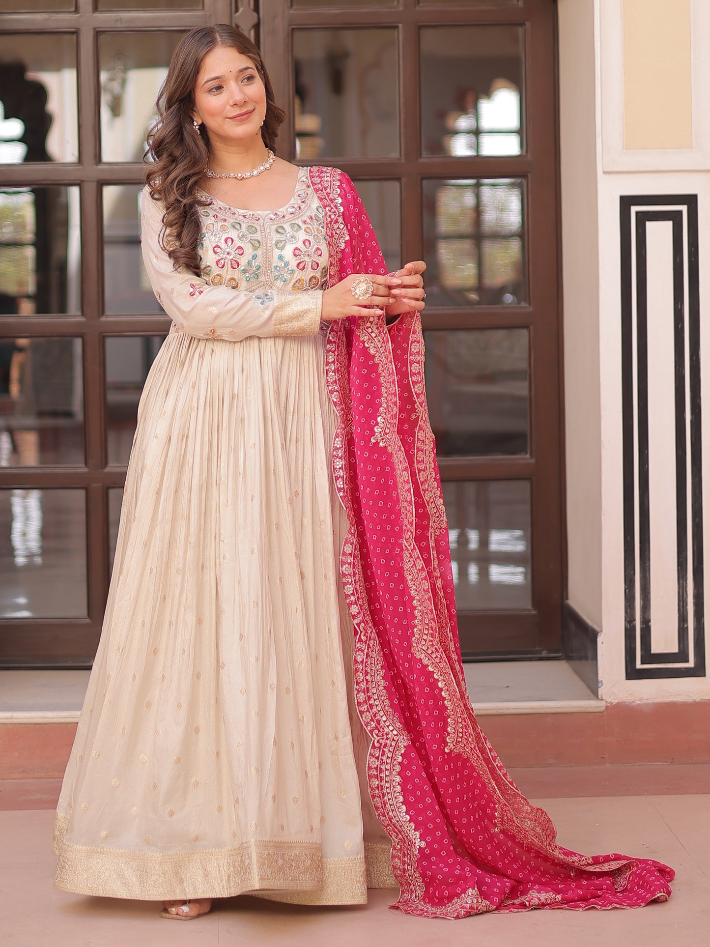 Marvelous Cream Silk Gown With Pink Bandhani Dupatta