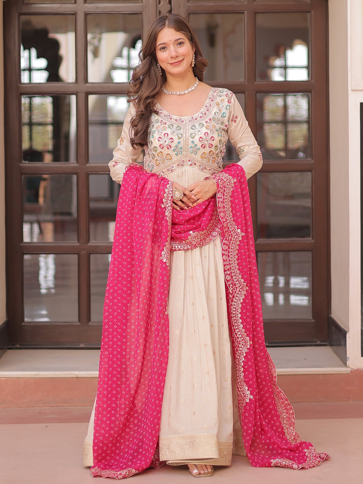 Marvelous Cream Silk Gown With Pink Bandhani Dupatta