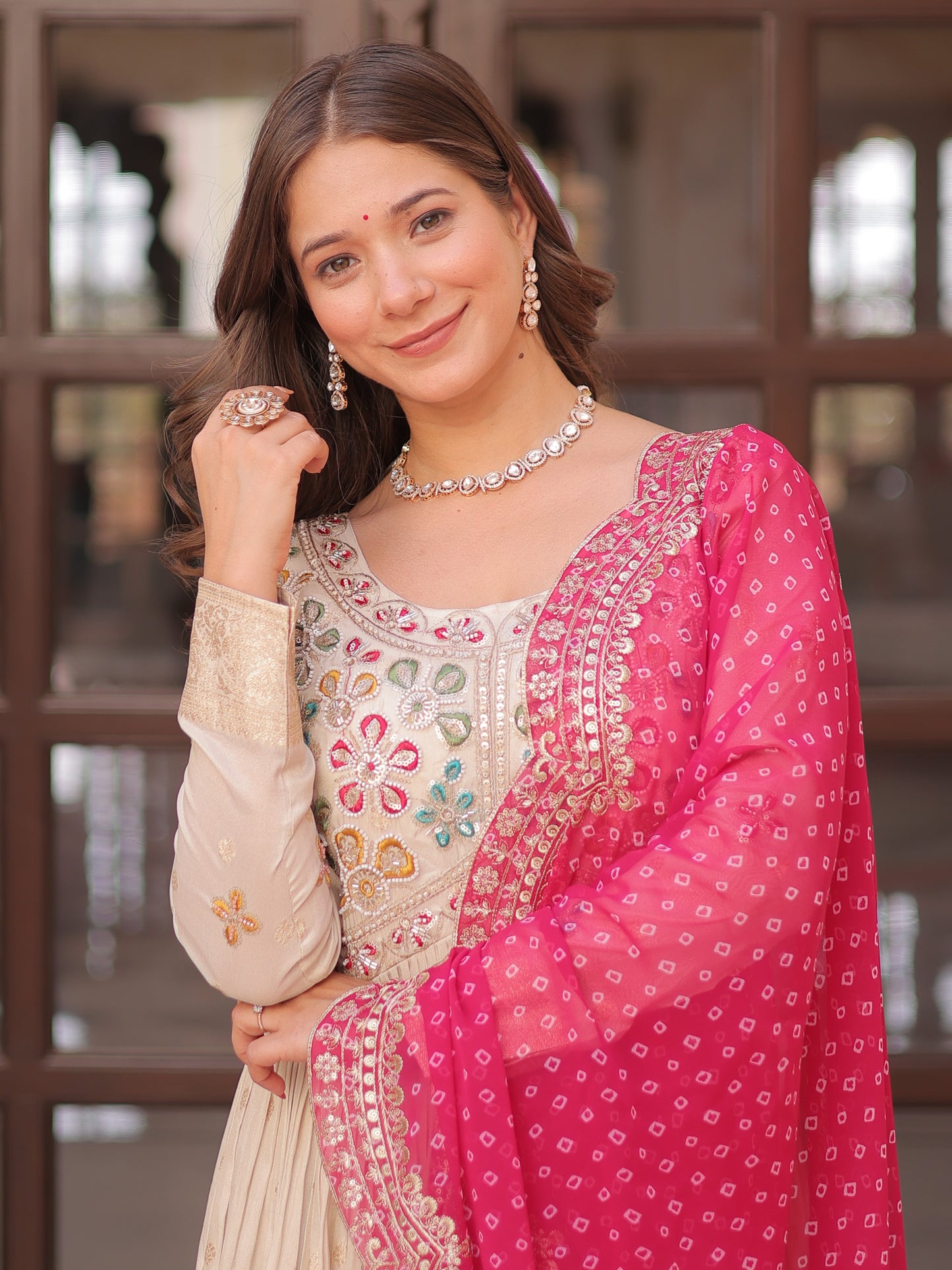 Marvelous Cream Silk Gown With Pink Bandhani Dupatta