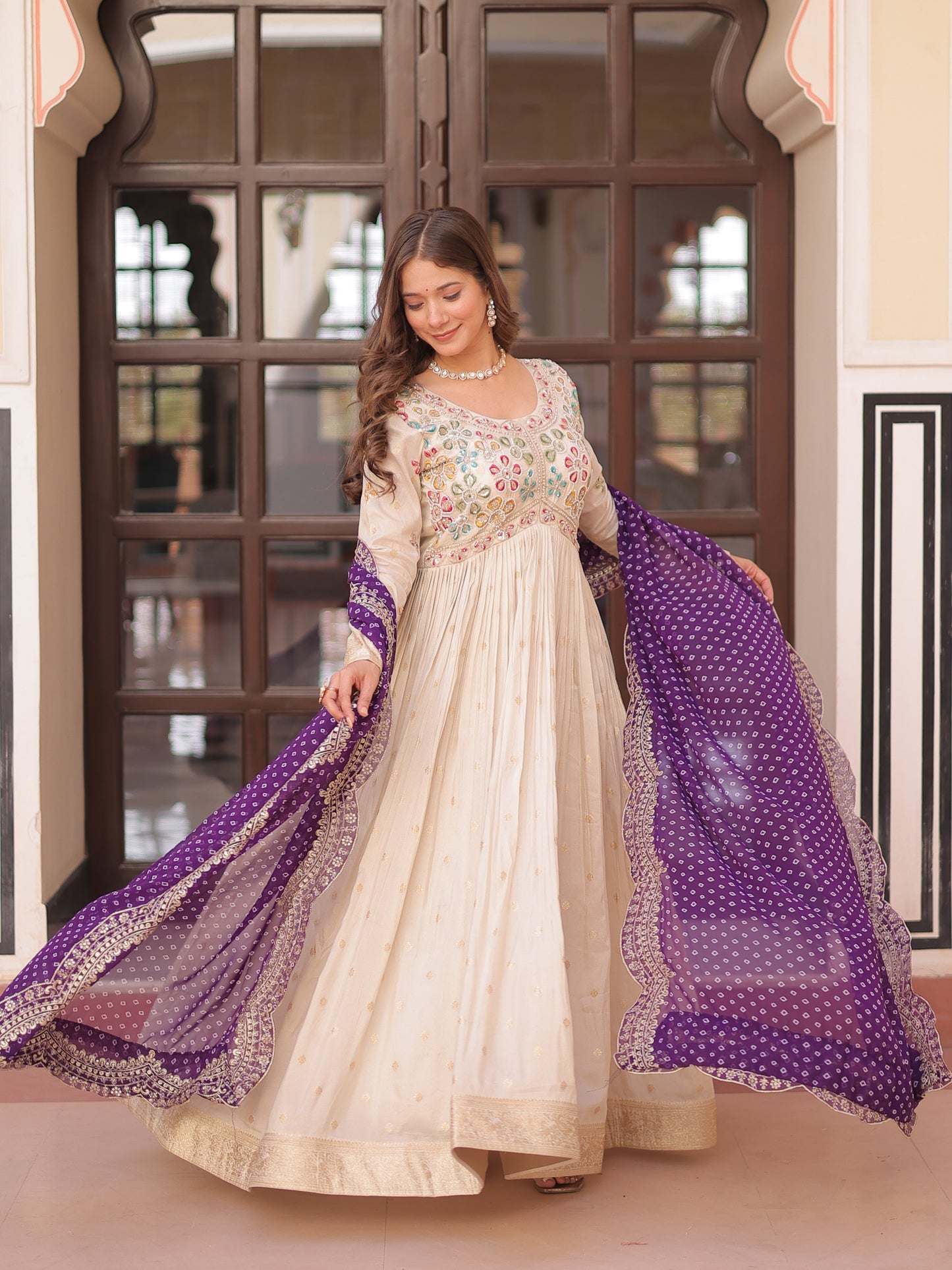 Attractive Cream Zari Work Silk Gown With Bandhani Dupatta