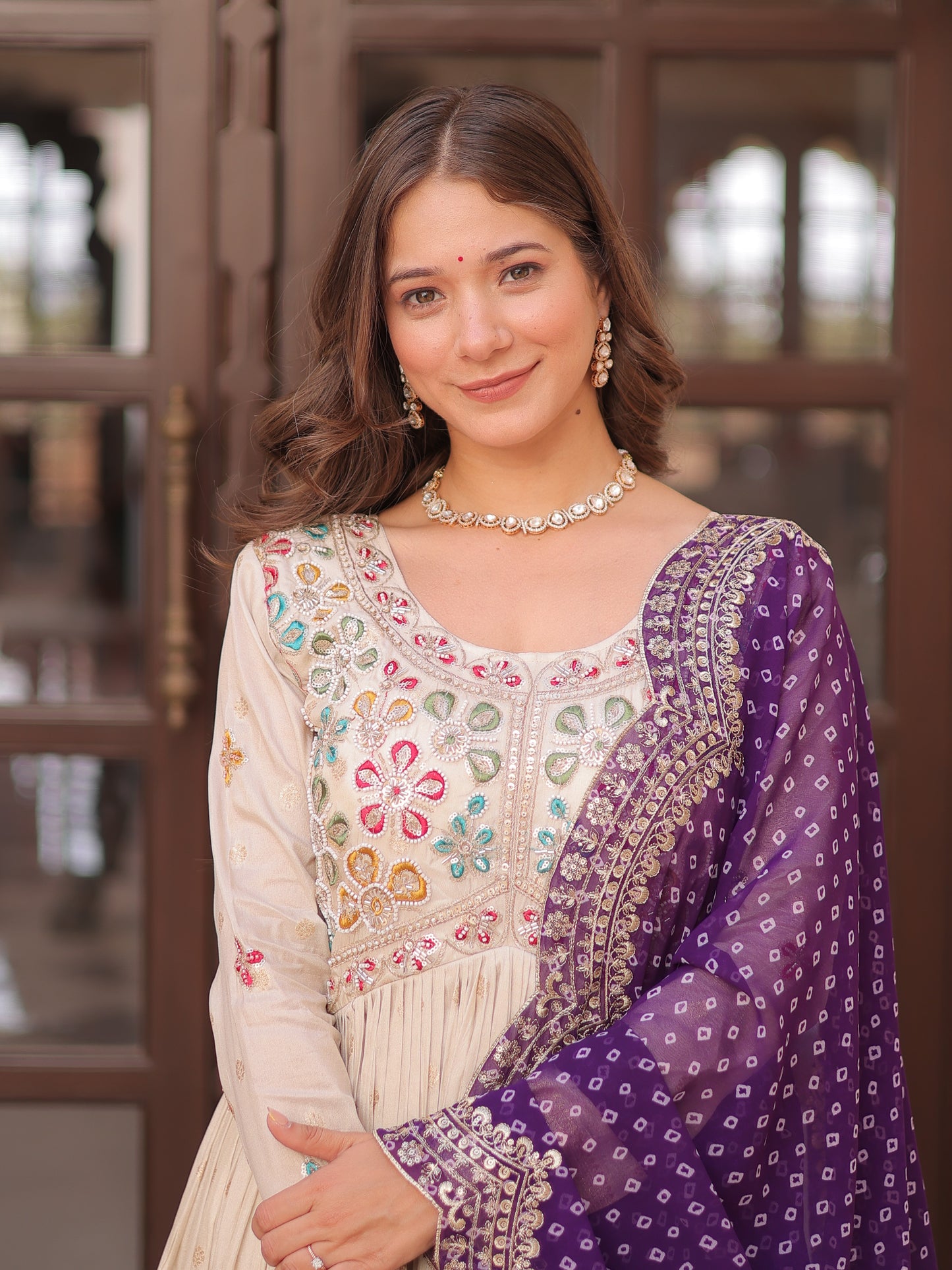 Attractive Cream Zari Work Silk Gown With Bandhani Dupatta