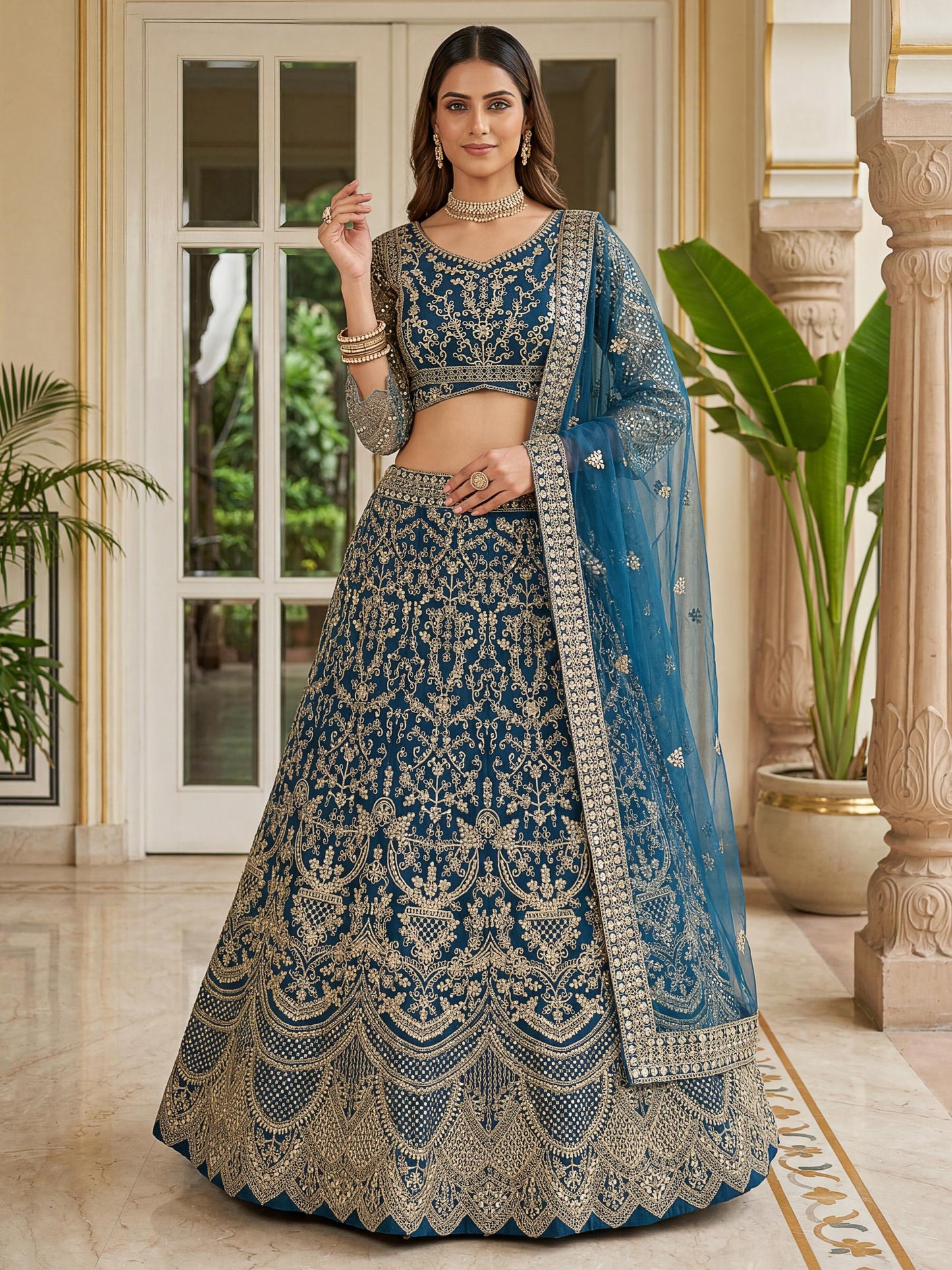 Spectacular Teal Blue Heavy Embroidered Net Reception Lehenga Choli