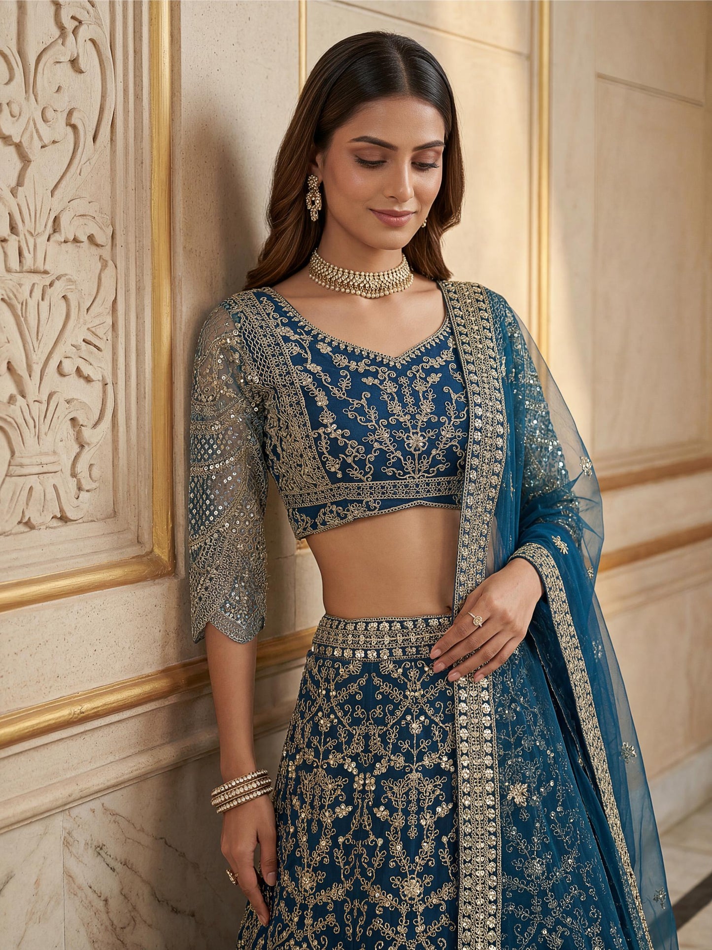 Spectacular Teal Blue Heavy Embroidered Net Reception Lehenga Choli