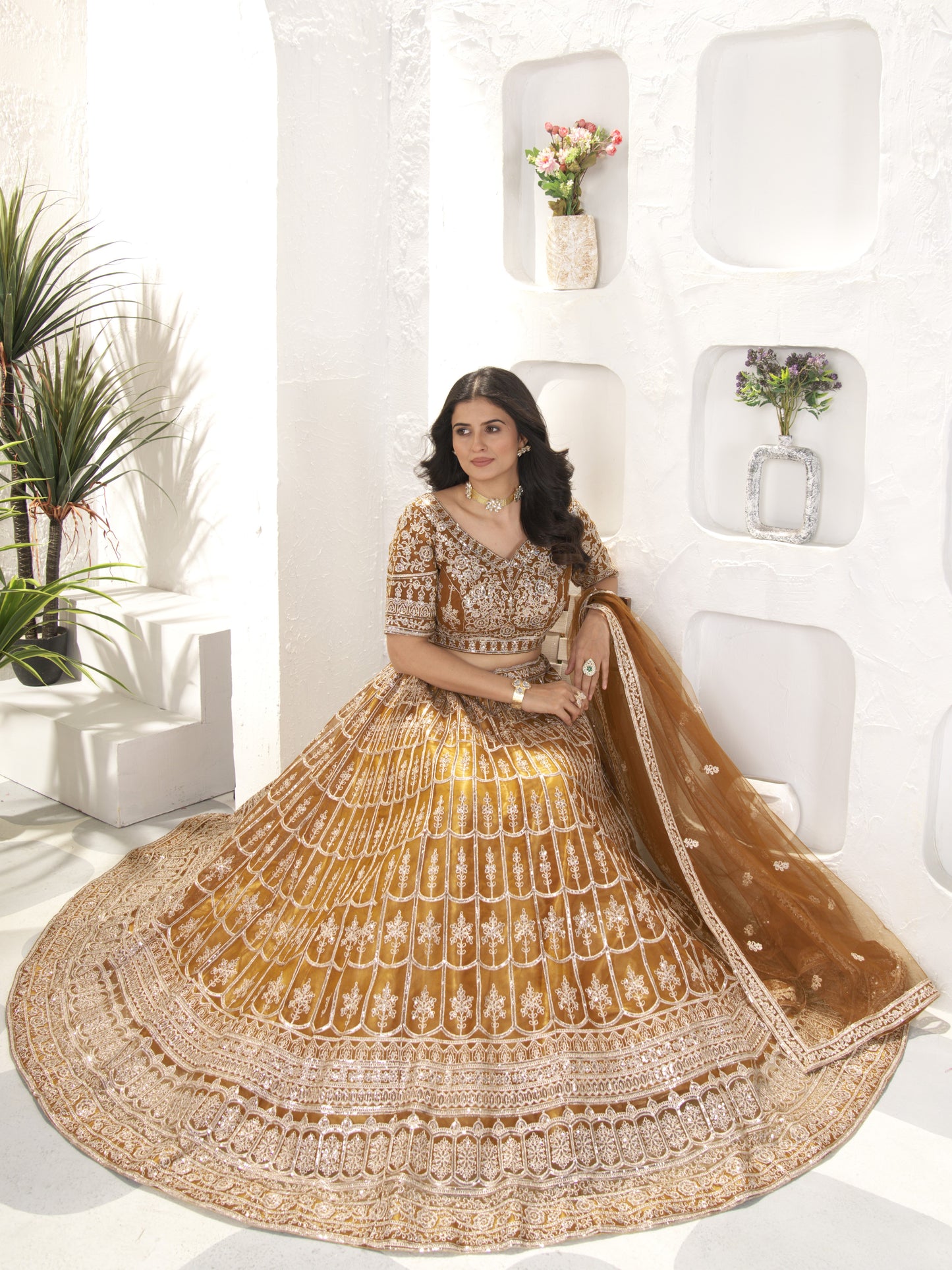 Precious Brown Heavy Embroidered Net Engagement Lehenga Choli