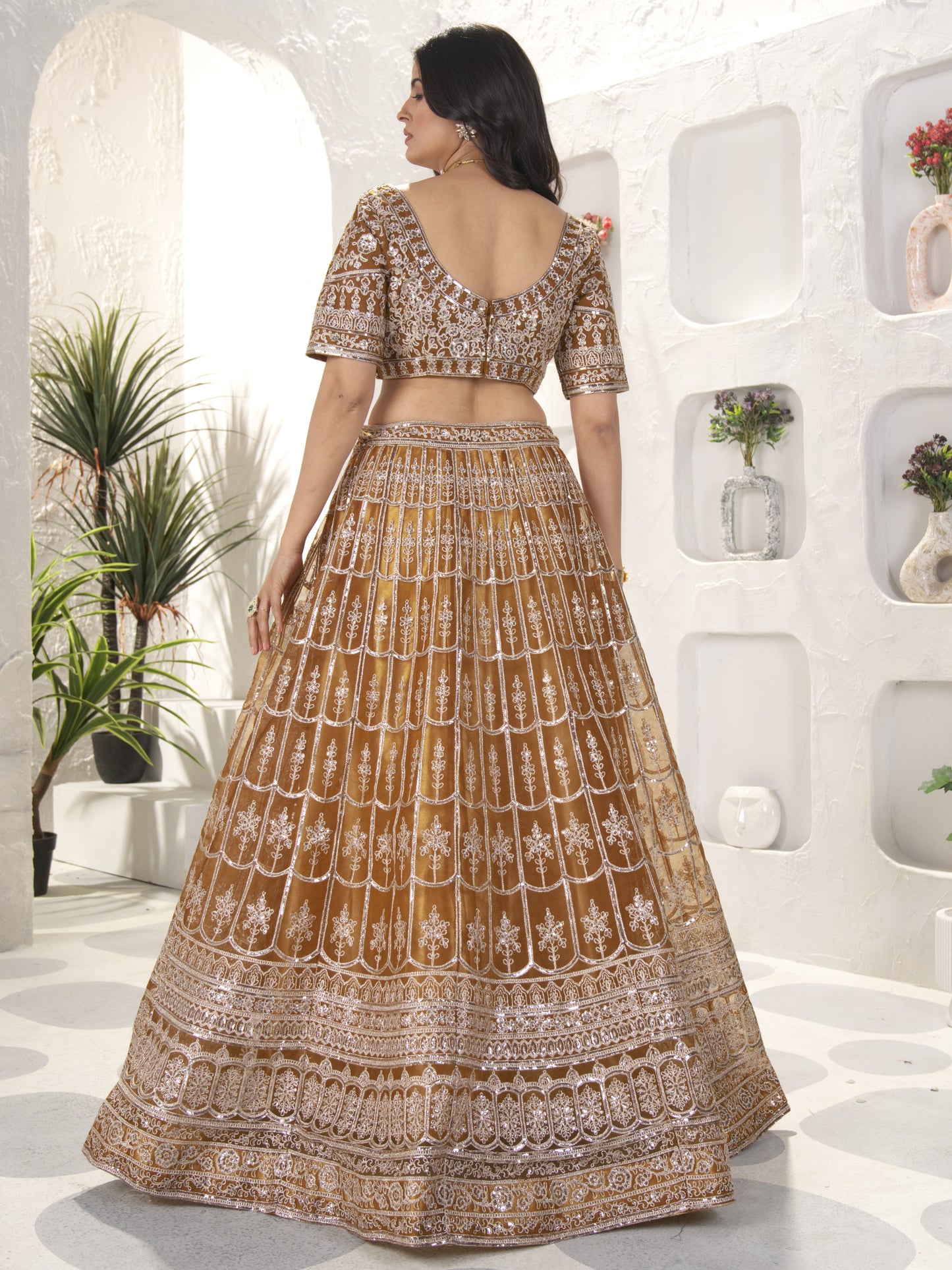Precious Brown Heavy Embroidered Net Engagement Lehenga Choli